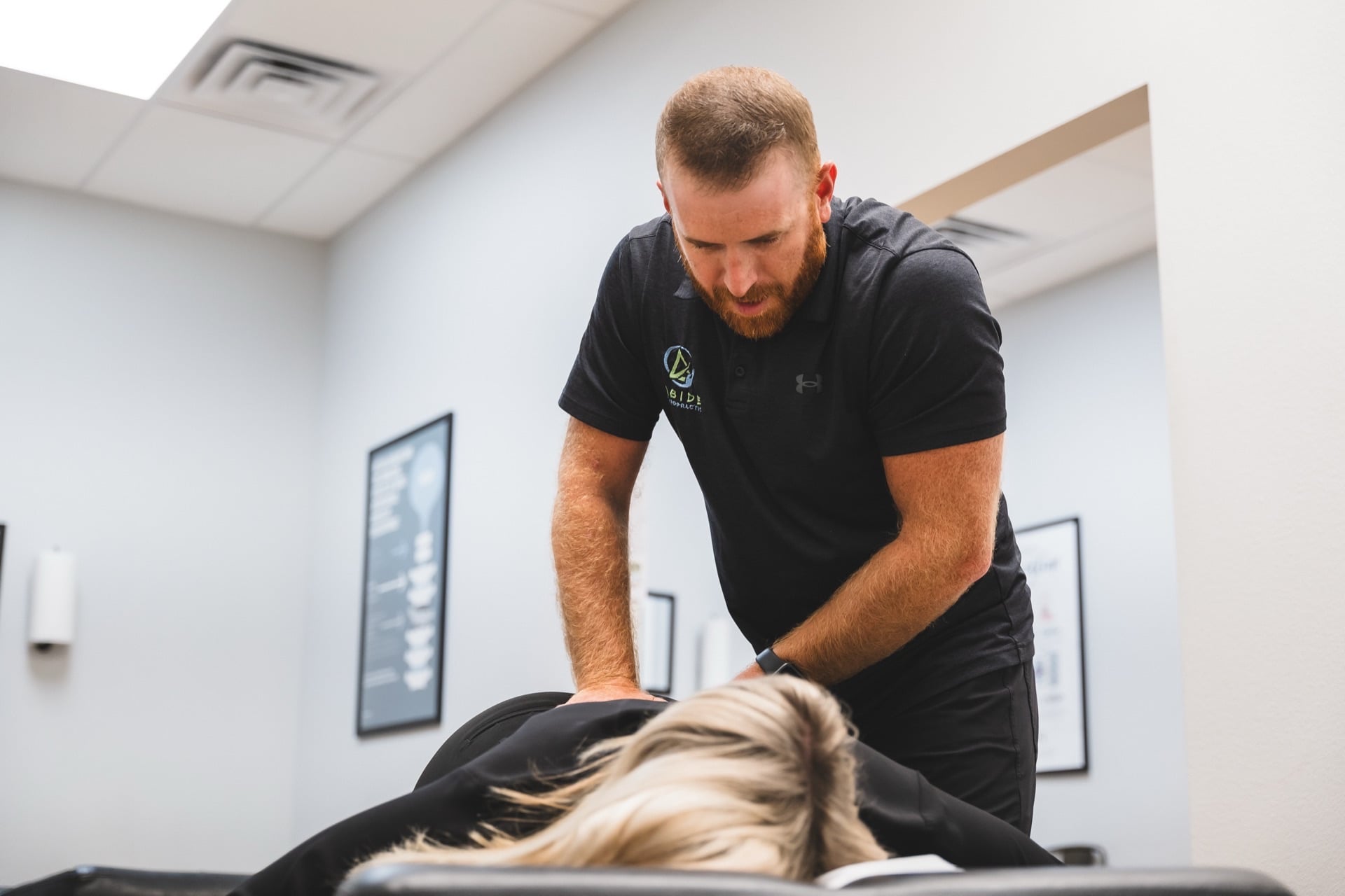 An Abide Chiropractic doctor giving a patient a gentle adjustment